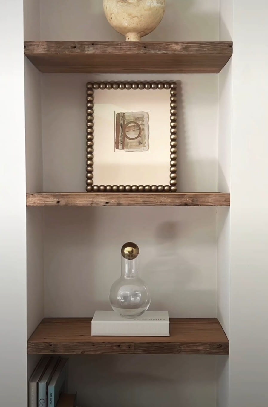Custom framed art hung in a home